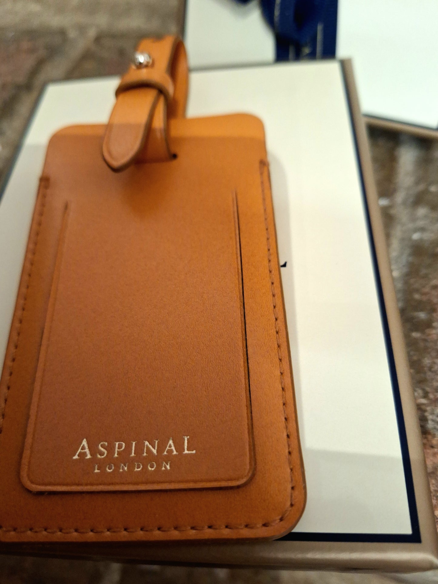 Aspinal tan luggage tag